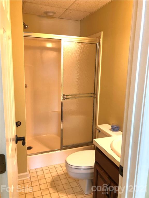 4516 Kiser Island Road Terrell, NC 28682 - Photo 17 of 19 a bathroom with a granite countertop sink toilet and shower