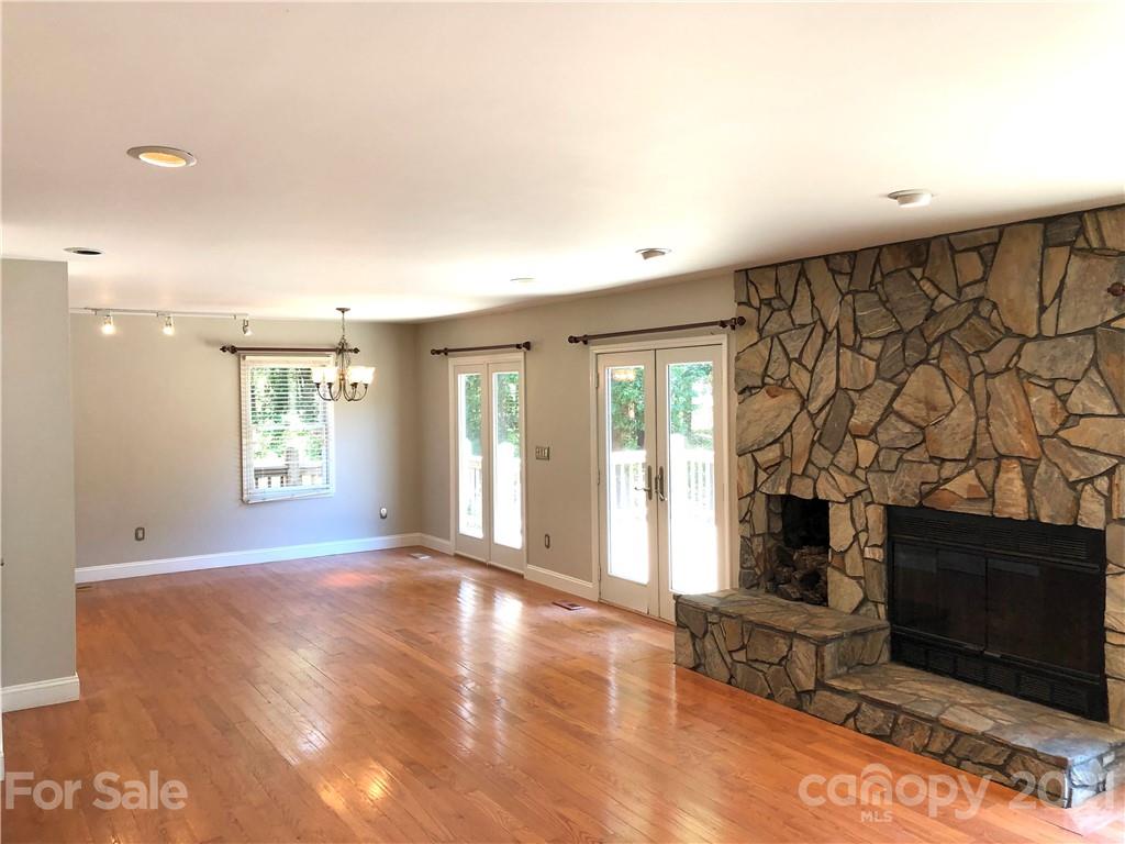 4516 Kiser Island Road Terrell, NC 28682 - Photo 5 of 19 a view of an empty room with a fireplace and a window