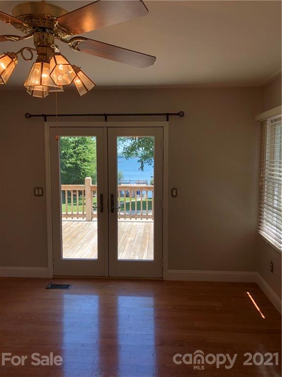 4516 Kiser Island Road Terrell, NC 28682 - Photo 8 of 19 a view of an empty room with wooden floor and a window