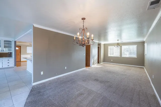 a kitchen with cabinets stainless steel appliances and counter space