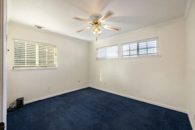 a view of a swimming pool with a yard