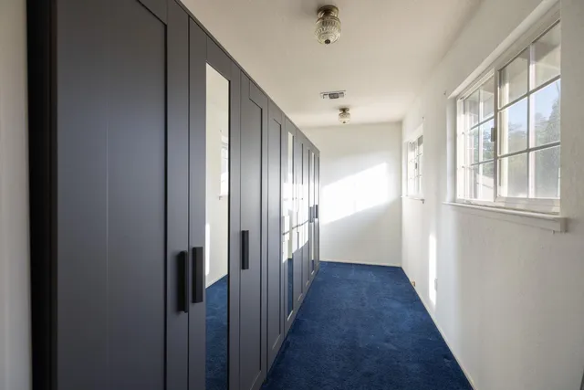 a view of a swimming pool in a backyard