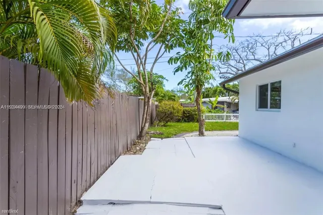 a view of a backyard with a small cabin