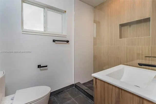 a bathroom with a sink a toilet