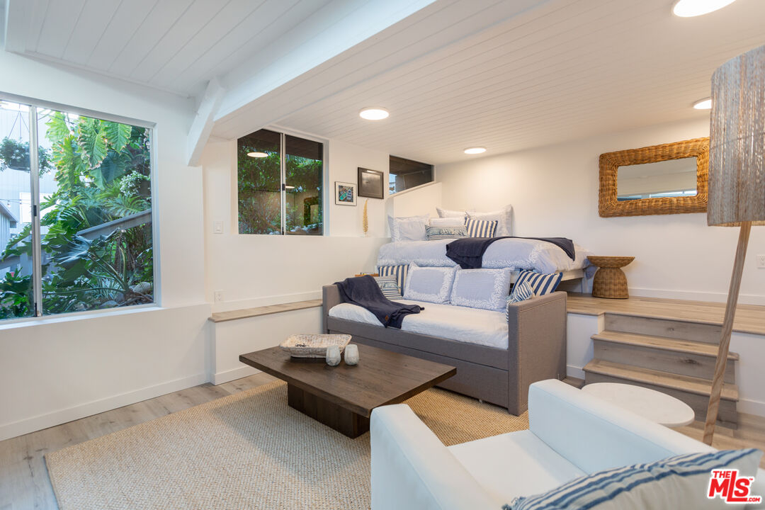 24246 Malibu Road Malibu, CA 90265 - Photo 16 of 20 a living room with furniture and a large window