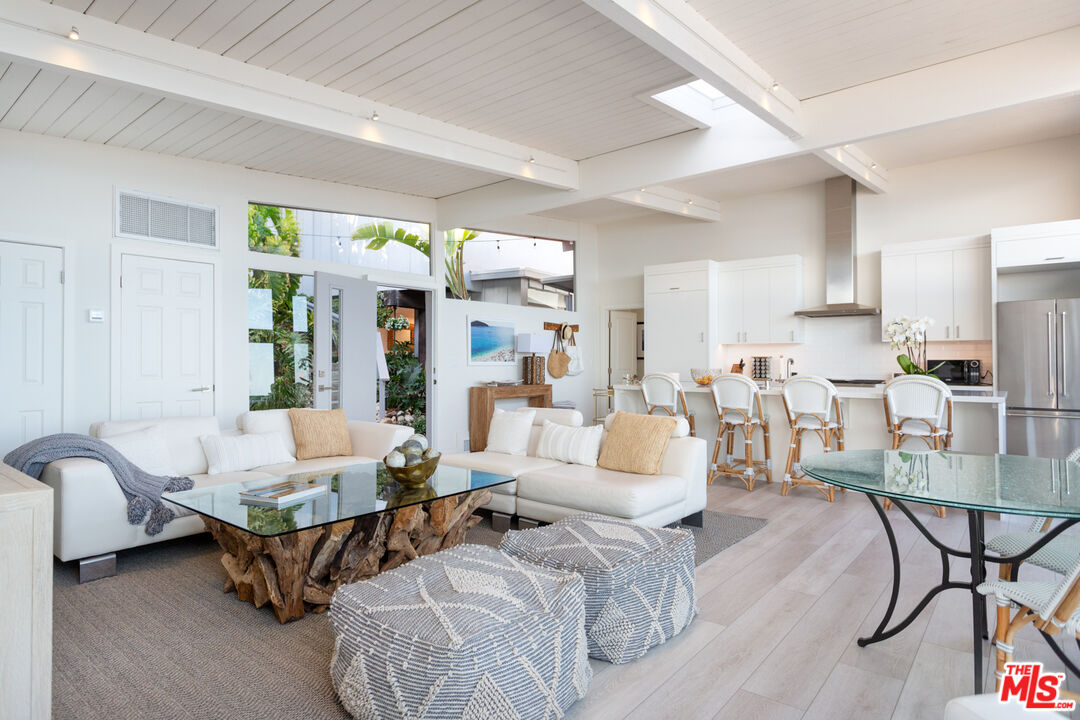 24246 Malibu Road Malibu, CA 90265 - Photo 4 of 20 a living room with furniture and a large window