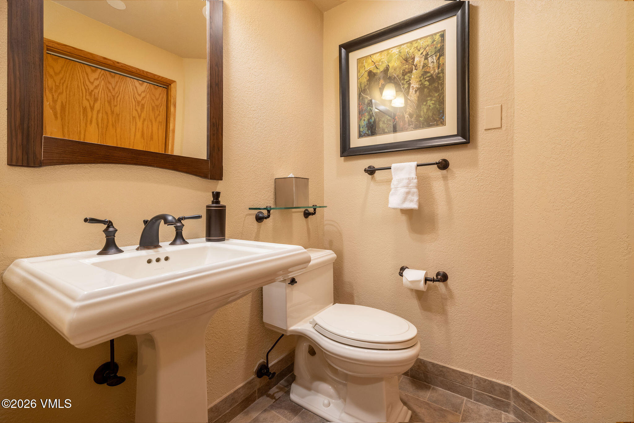 120 Offerson Road, Unit 7220/25 Beaver Creek, CO 81620 - Photo 13 of 17 a bathroom with a sink mirror and toilet