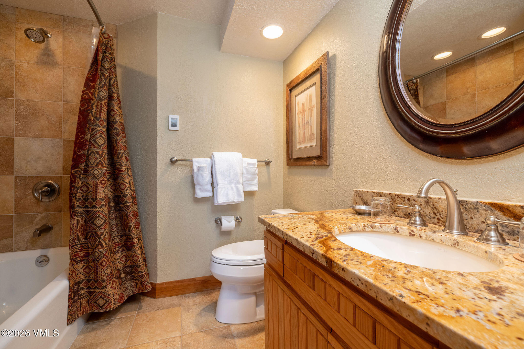 120 Offerson Road, Unit 7220/25 Beaver Creek, CO 81620 - Photo 15 of 17 a bathroom with a granite countertop sink and a mirror