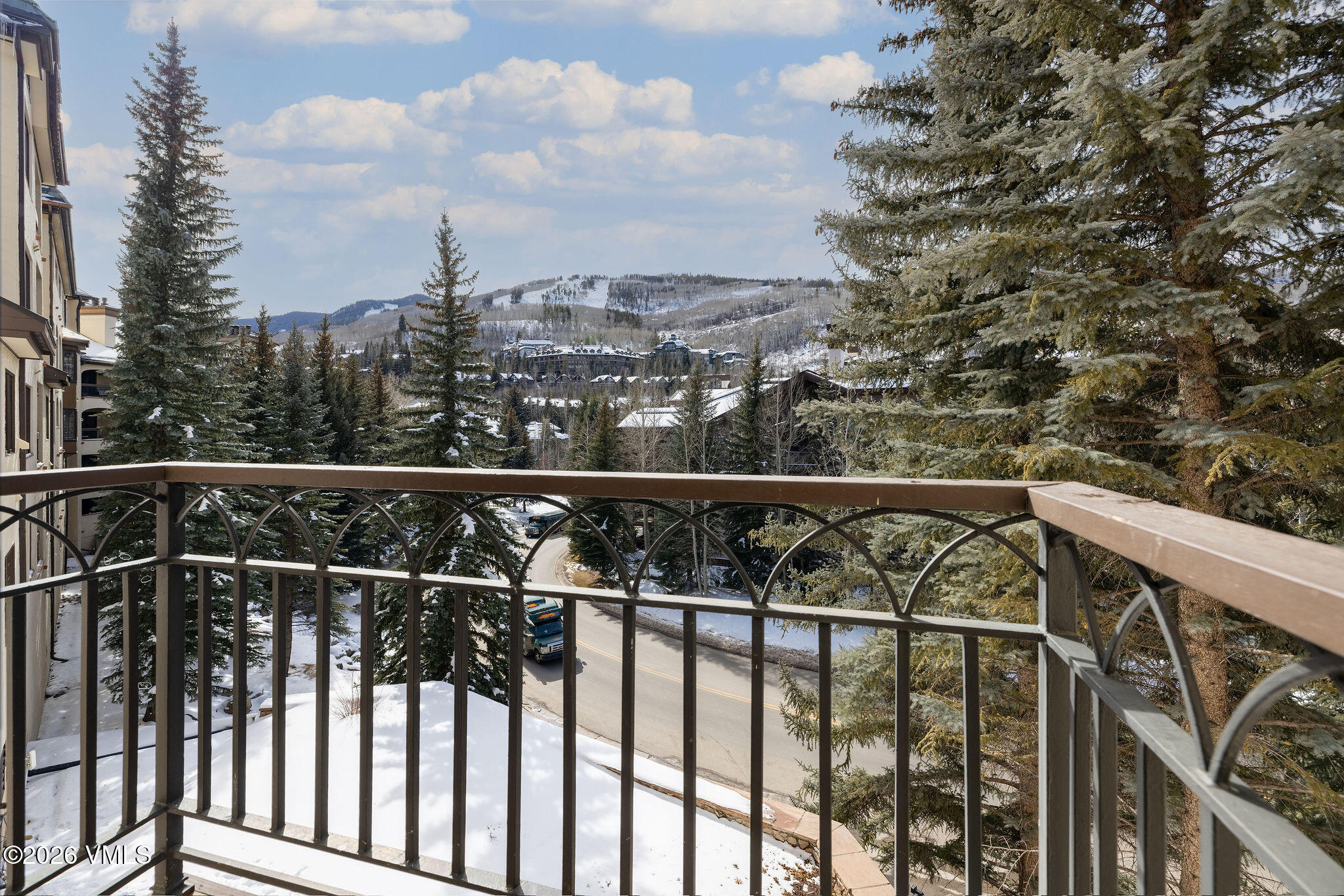 120 Offerson Road, Unit 7220/25 Beaver Creek, CO 81620 - Photo 3 of 17 a view of a balcony with wooden fence and floor