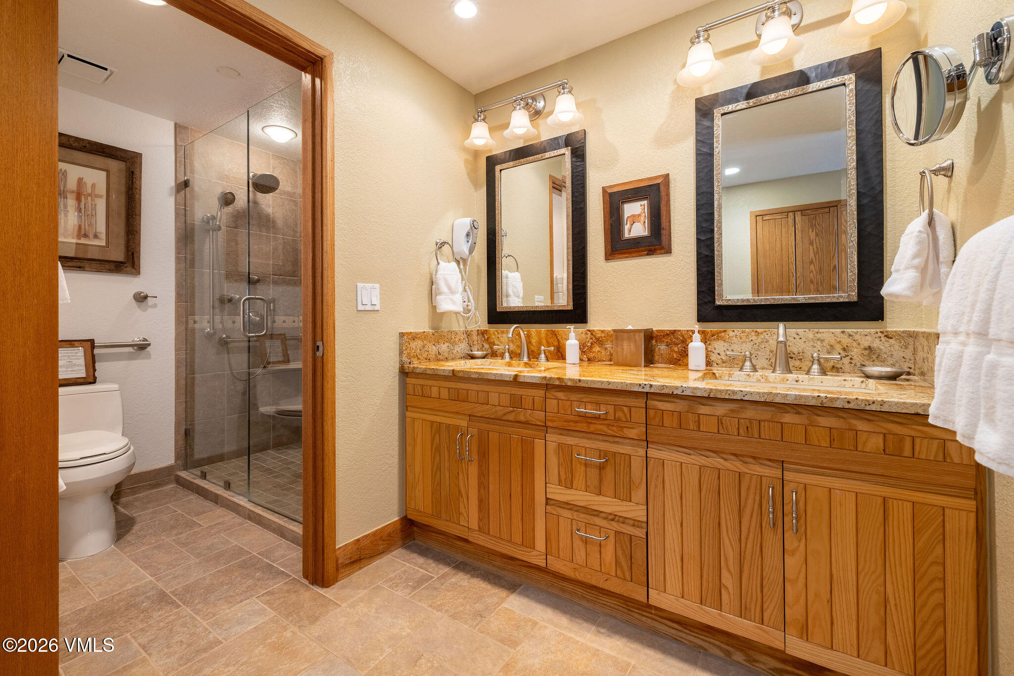 120 Offerson Road, Unit 7220/25 Beaver Creek, CO 81620 - Photo 5 of 17 a bathroom with double sink and a mirror