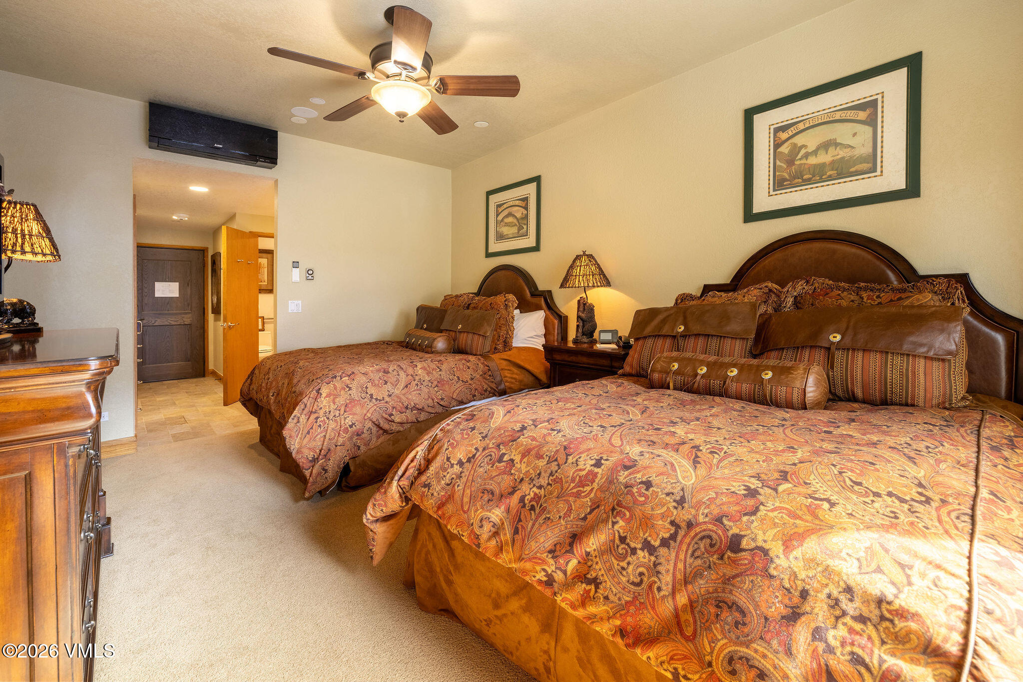 120 Offerson Road, Unit 7220/25 Beaver Creek, CO 81620 - Photo 7 of 17 a bedroom with two beds and painting on the wall