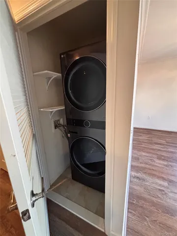a bathroom with a granite countertop toilet sink and mirror