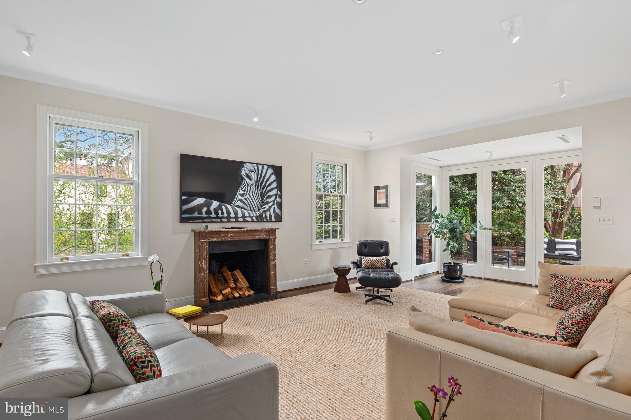 2468 Belmont Road Northwest Washington, DC 20008 - Photo 11 of 49 a living room with furniture a fireplace and a large window