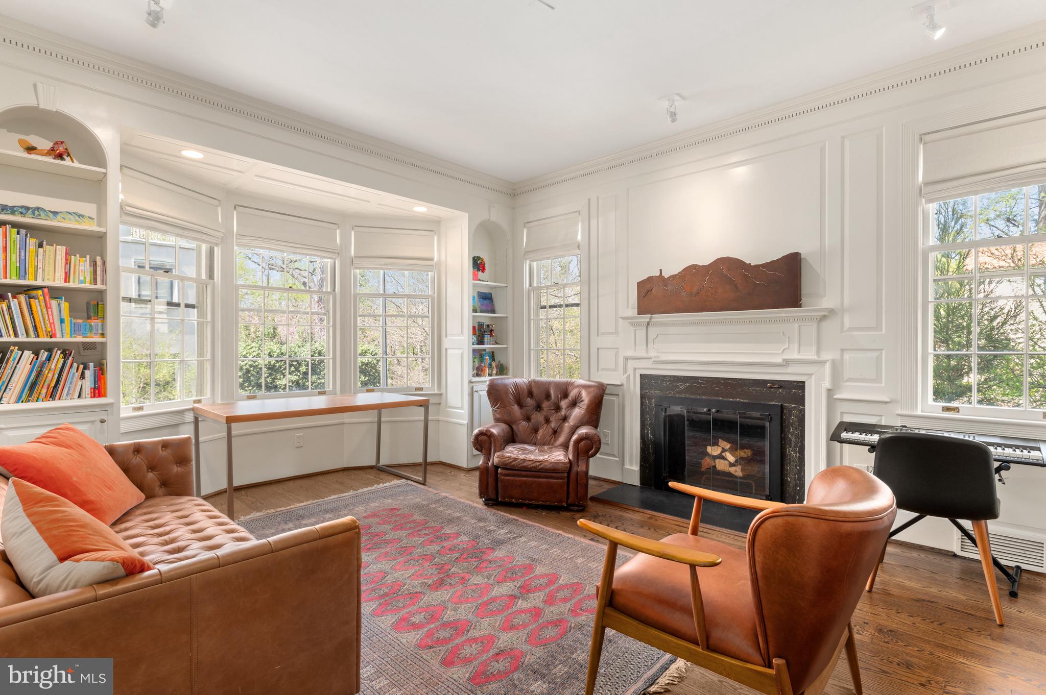 2468 Belmont Road Northwest Washington, DC 20008 - Photo 16 of 49 a living room with furniture and a fireplace