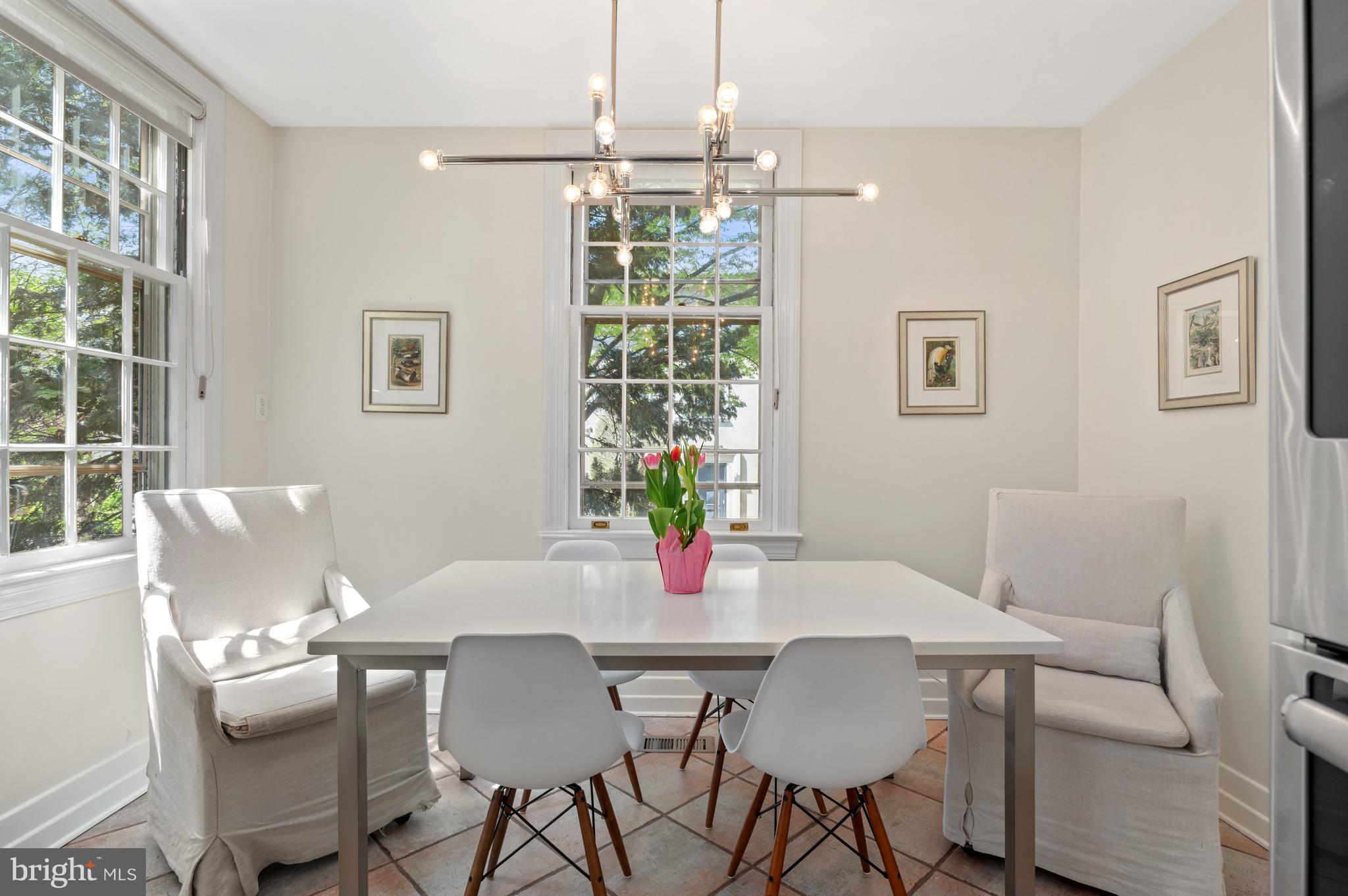 2468 Belmont Road Northwest Washington, DC 20008 - Photo 21 of 49 a view of a dining room with furniture wooden floor and chandelier
