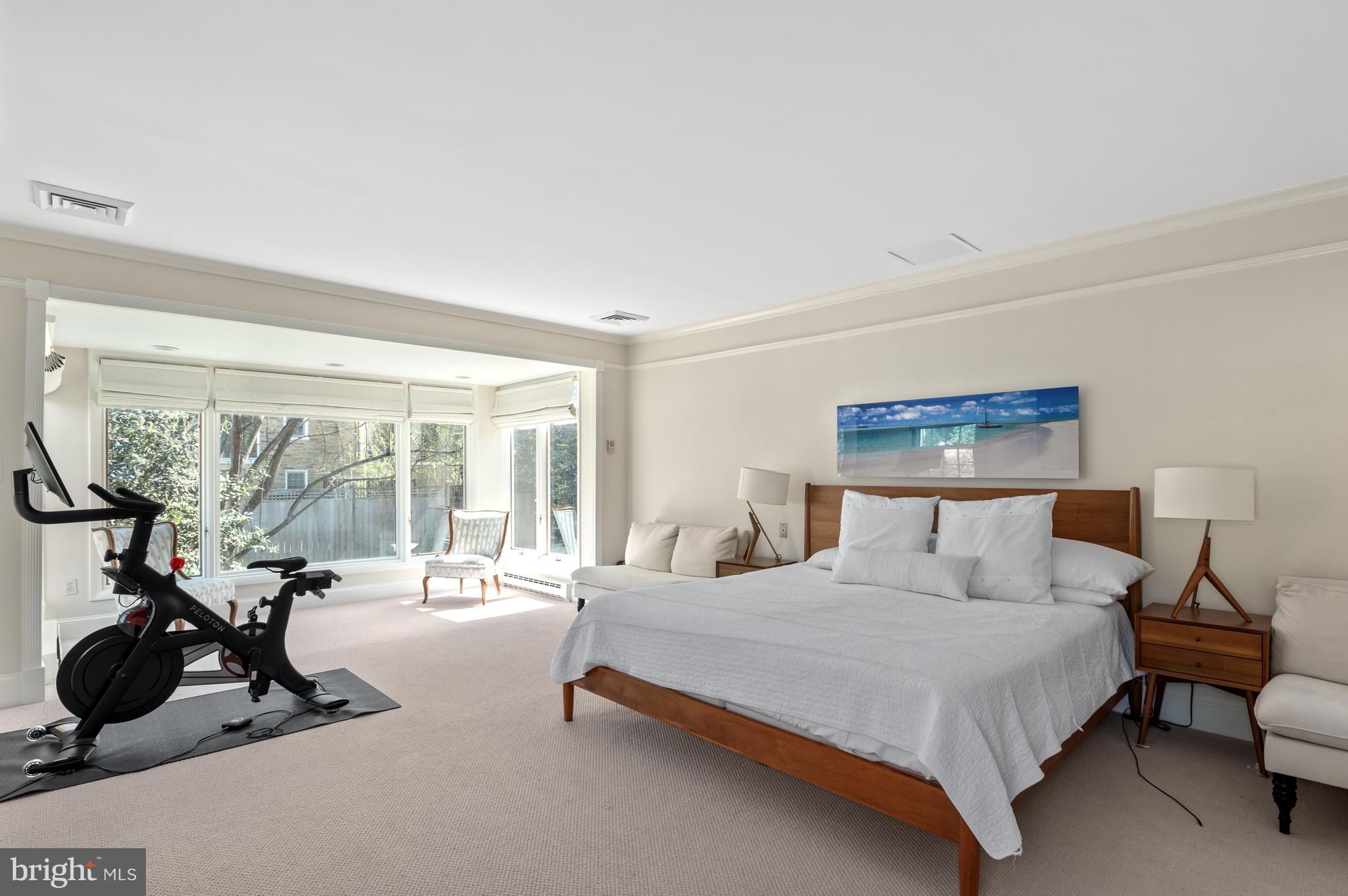 2468 Belmont Road Northwest Washington, DC 20008 - Photo 25 of 49 a bedroom with a bed a couch and a large window