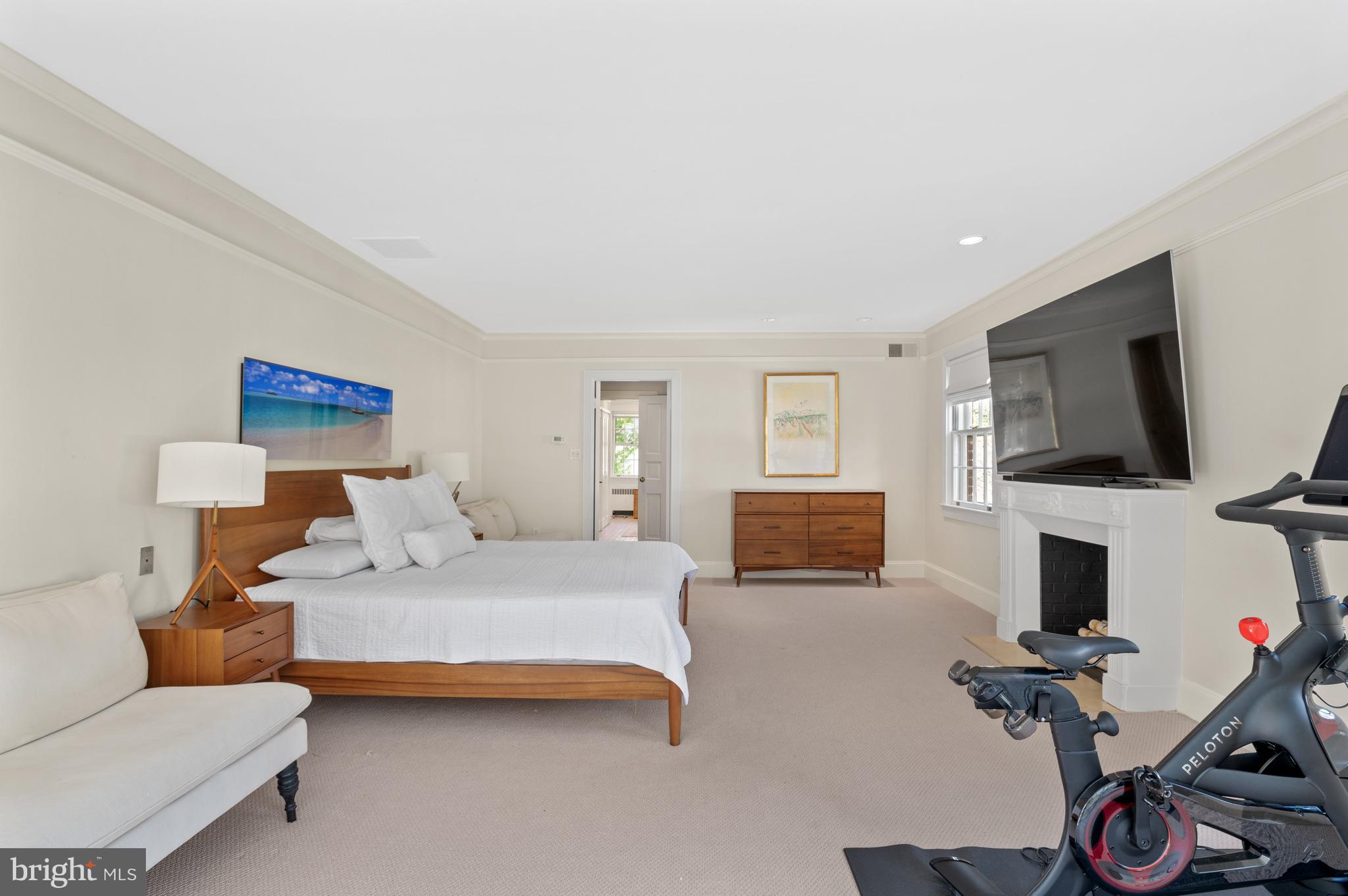 2468 Belmont Road Northwest Washington, DC 20008 - Photo 27 of 49 a bedroom with a bed and a flat screen tv