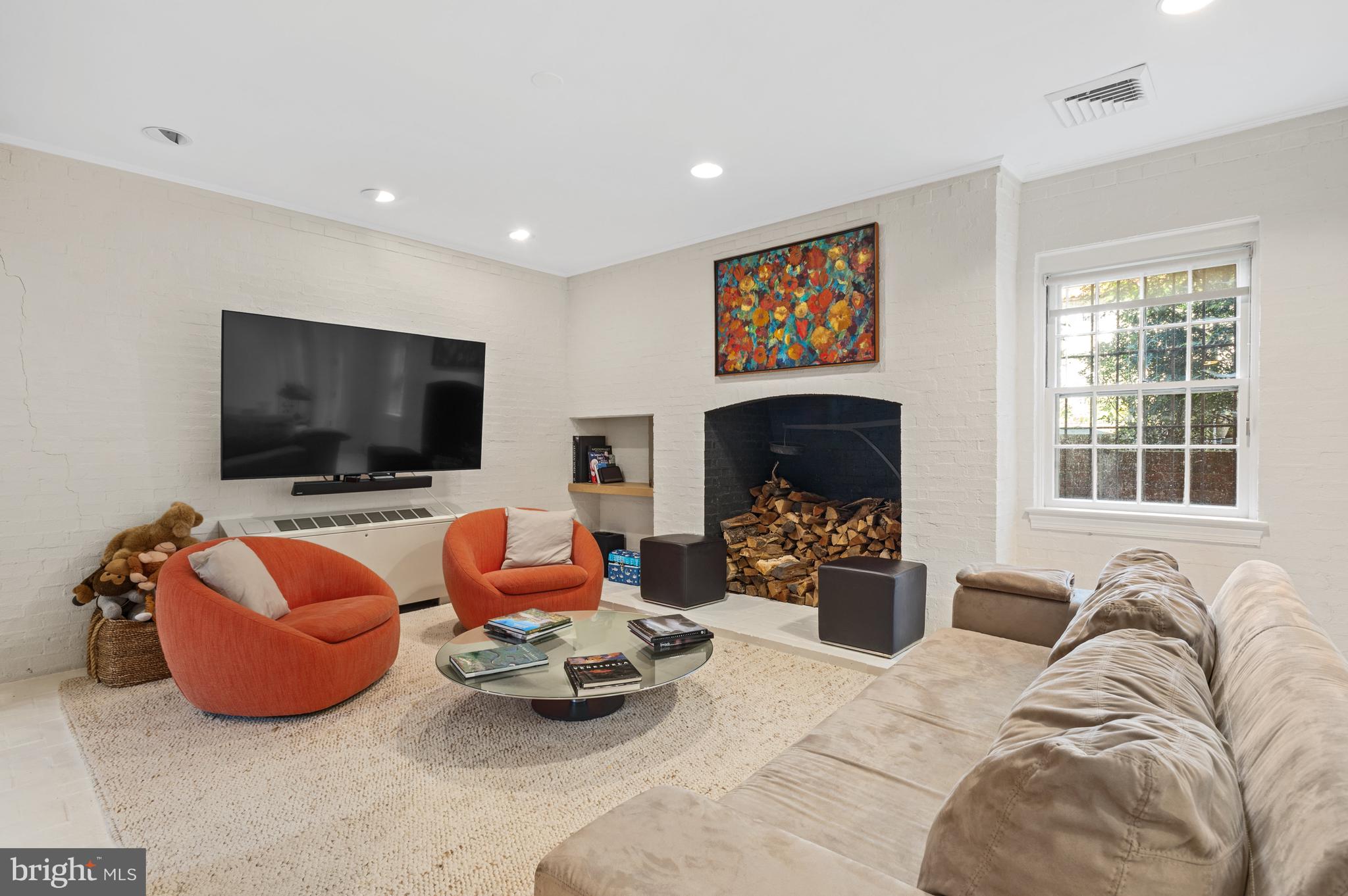 2468 Belmont Road Northwest Washington, DC 20008 - Photo 35 of 49 a living room with furniture and a flat screen tv