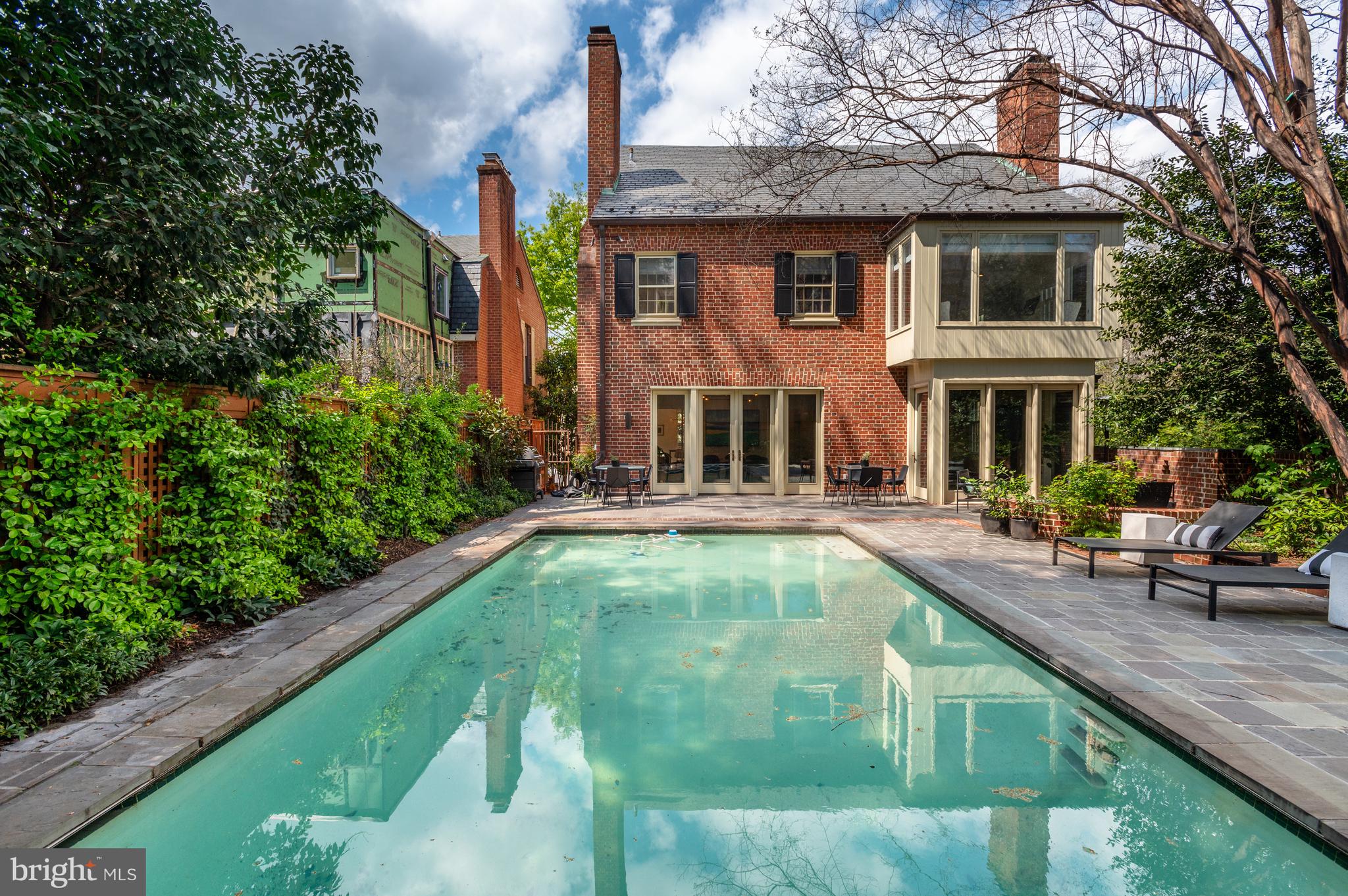 2468 Belmont Road Northwest Washington, DC 20008 - Photo 43 of 49 a swimming pool with outdoor seating and yard