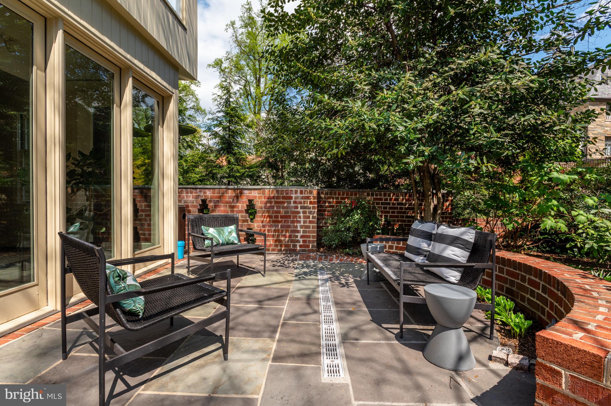 2468 Belmont Road Northwest Washington, DC 20008 - Photo 45 of 49 a view of a patio with chairs and a potted plant
