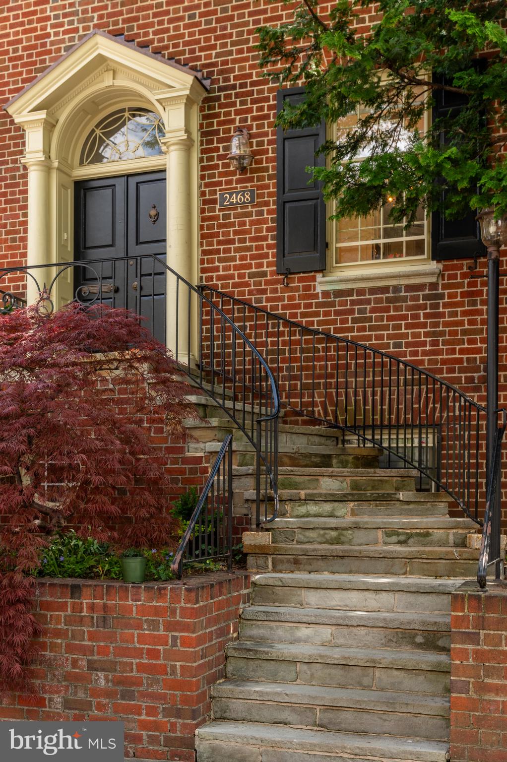 2468 Belmont Road Northwest Washington, DC 20008 - Photo 5 of 49 a view of a brick house with large windows
