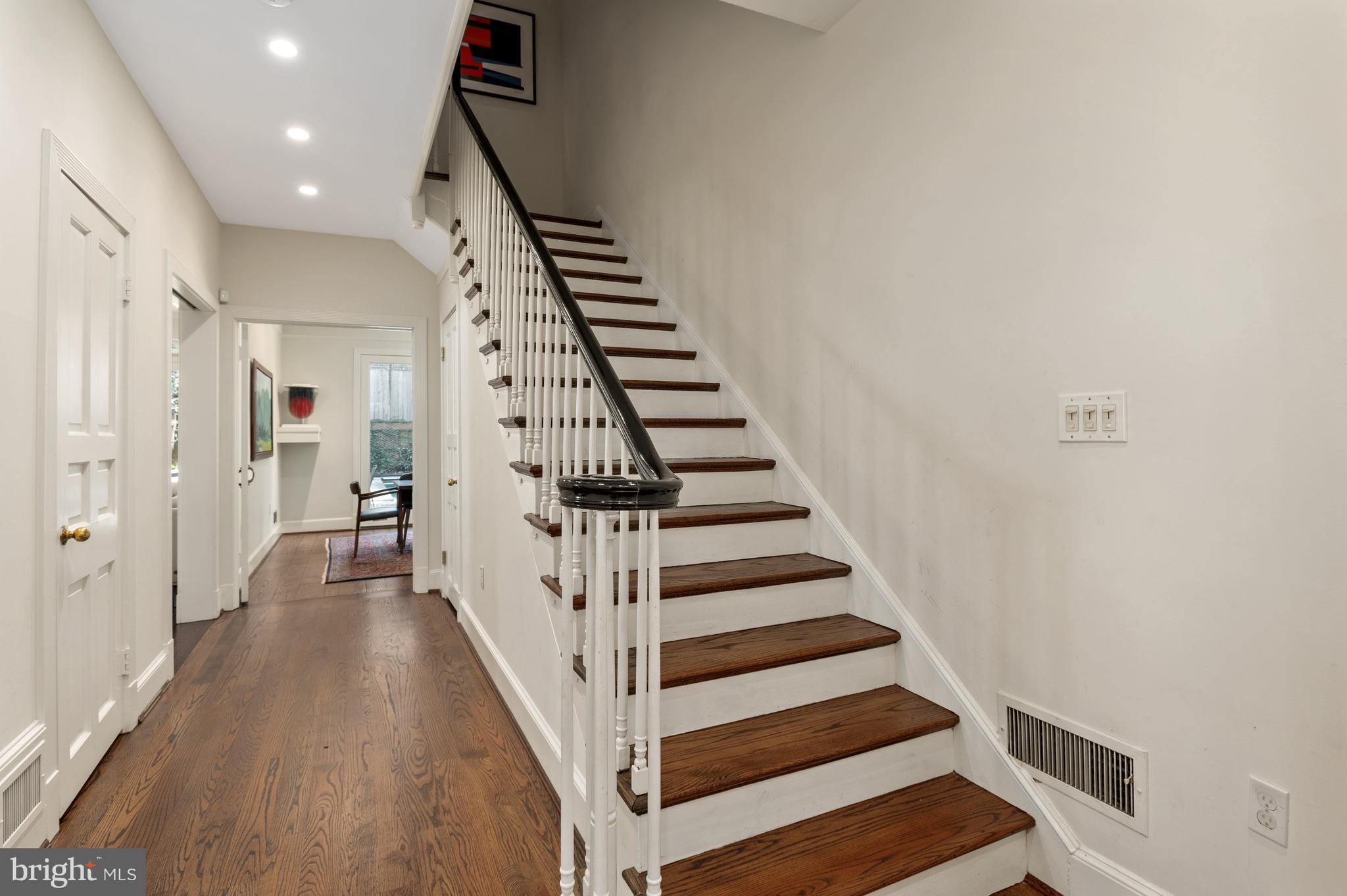 2468 Belmont Road Northwest Washington, DC 20008 - Photo 6 of 49 a view of a hallway with wooden floor and entryway