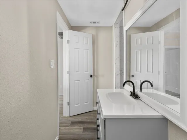 a bathroom with a sink and mirror