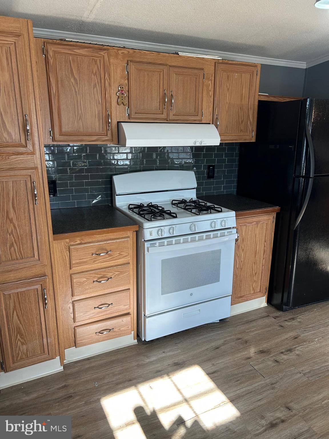 3 Vagabond Road Middletown, PA 17057 - Photo 4 of 11 a kitchen with granite countertop a stove a washer and dryer