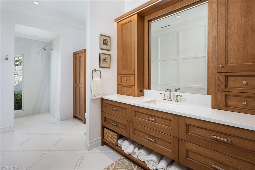 6975 Green Tree Drive Naples, FL 34108 - Photo 18 of 33 Full bath featuring curtained shower, vanity, ornamental molding, and recessed lighting