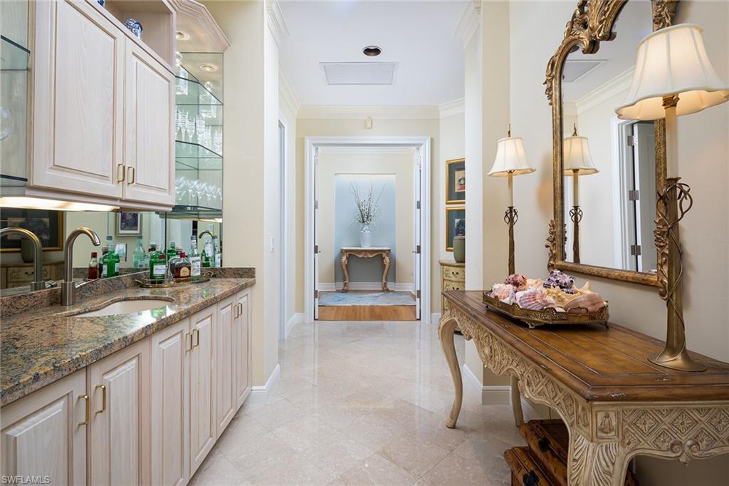 6975 Green Tree Drive Naples, FL 34108 - Photo 21 of 33 Hallway with crown molding