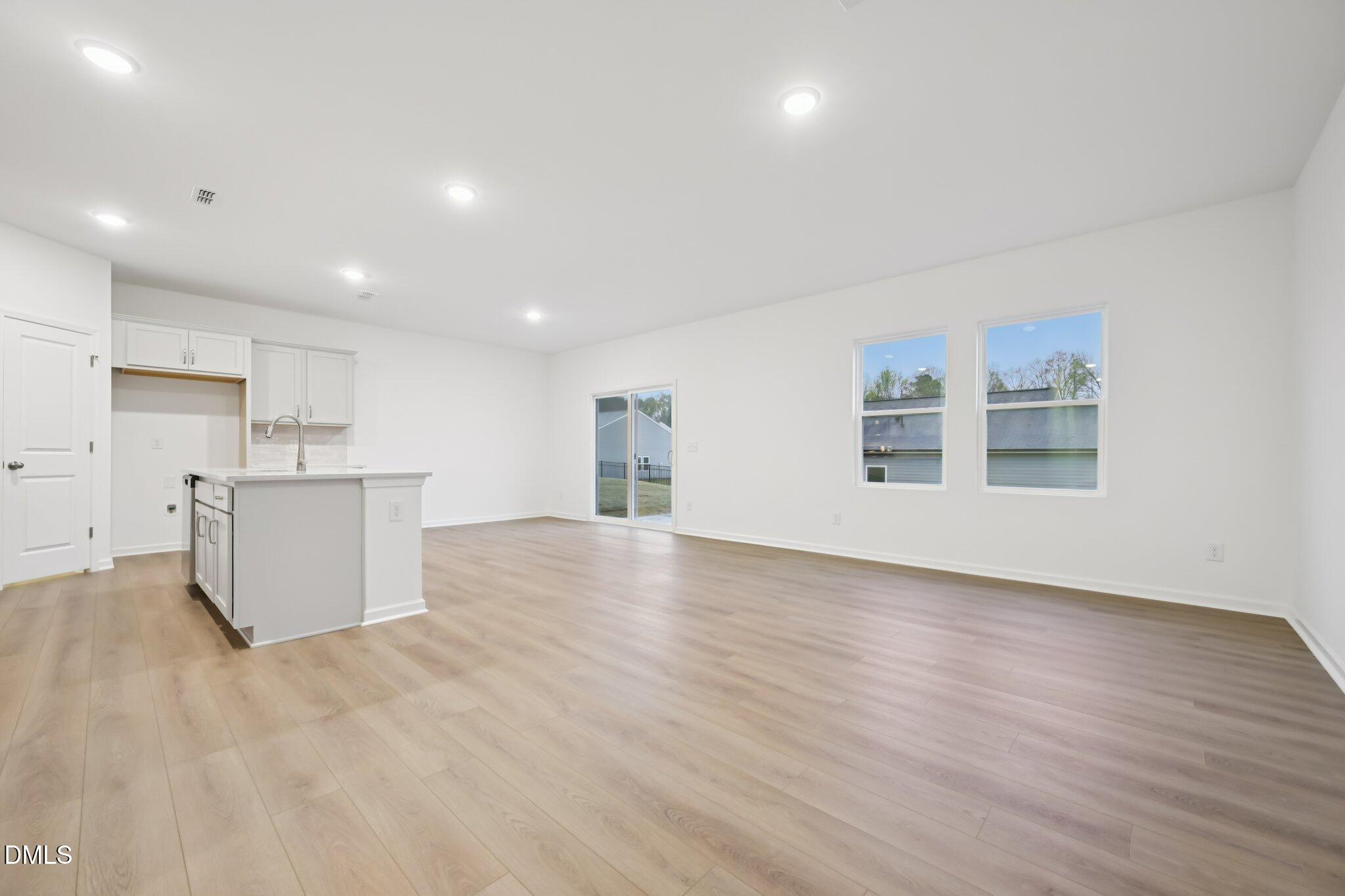 11730 Salers Loop Middlesex, NC 27557 - Photo 7 of 47 a view of a kitchen with a sink and a refrigerator
