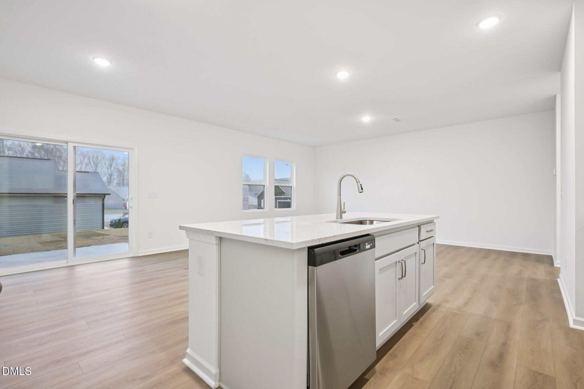 11730 Salers Loop Middlesex, NC 27557 - Photo 9 of 47 a kitchen with a sink and cabinets