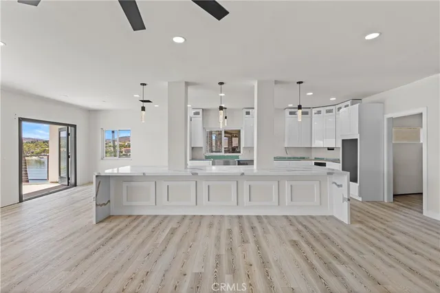 a bedroom with furniture and large window