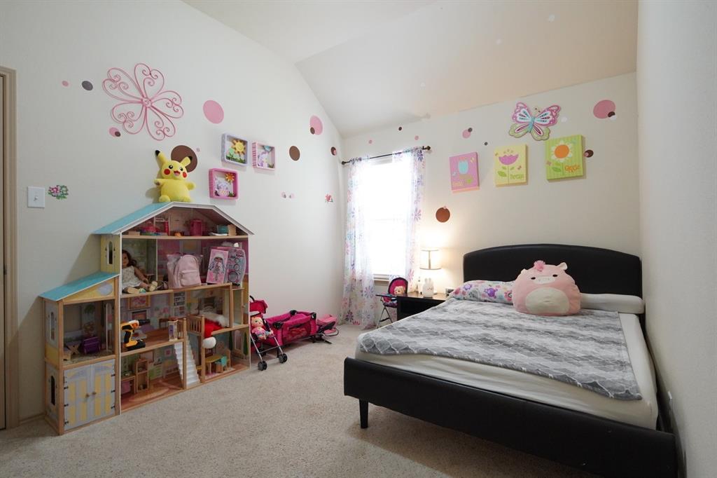 4508 Fox Rio Trail Arlington, TX 76017 - Photo 11 of 28 a bedroom with a bed and wooden floor