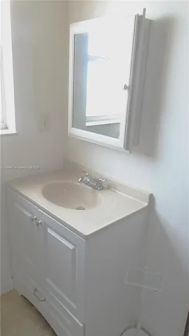 a bathroom with a sink and a vanity