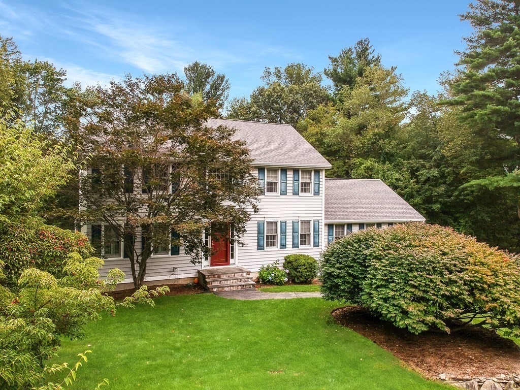 5 Judith E Lane Methuen, MA 01844 - Photo 2 of 38 a white house with a small yard and large trees