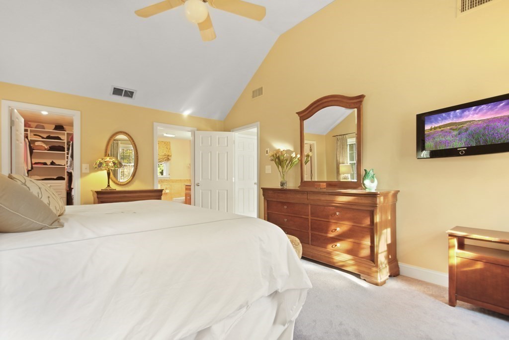 5 Judith E Lane Methuen, MA 01844 - Photo 21 of 38 a bedroom with a bed and a chandelier