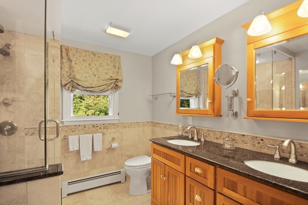 5 Judith E Lane Methuen, MA 01844 - Photo 24 of 38 a bathroom with a granite countertop sink mirror vanity and toilet