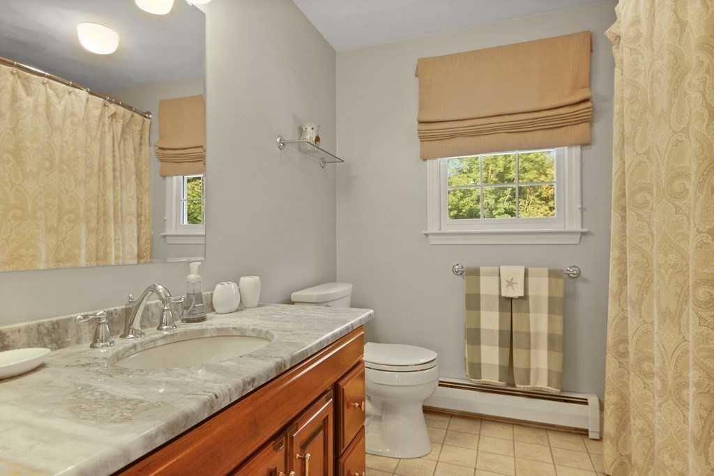 5 Judith E Lane Methuen, MA 01844 - Photo 27 of 38 a bathroom with a granite countertop sink toilet and shower