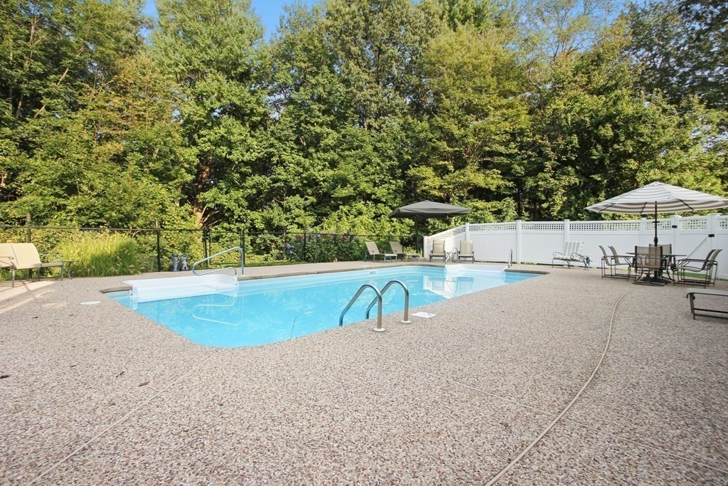 5 Judith E Lane Methuen, MA 01844 - Photo 35 of 38 a view of a swimming pool with a patio