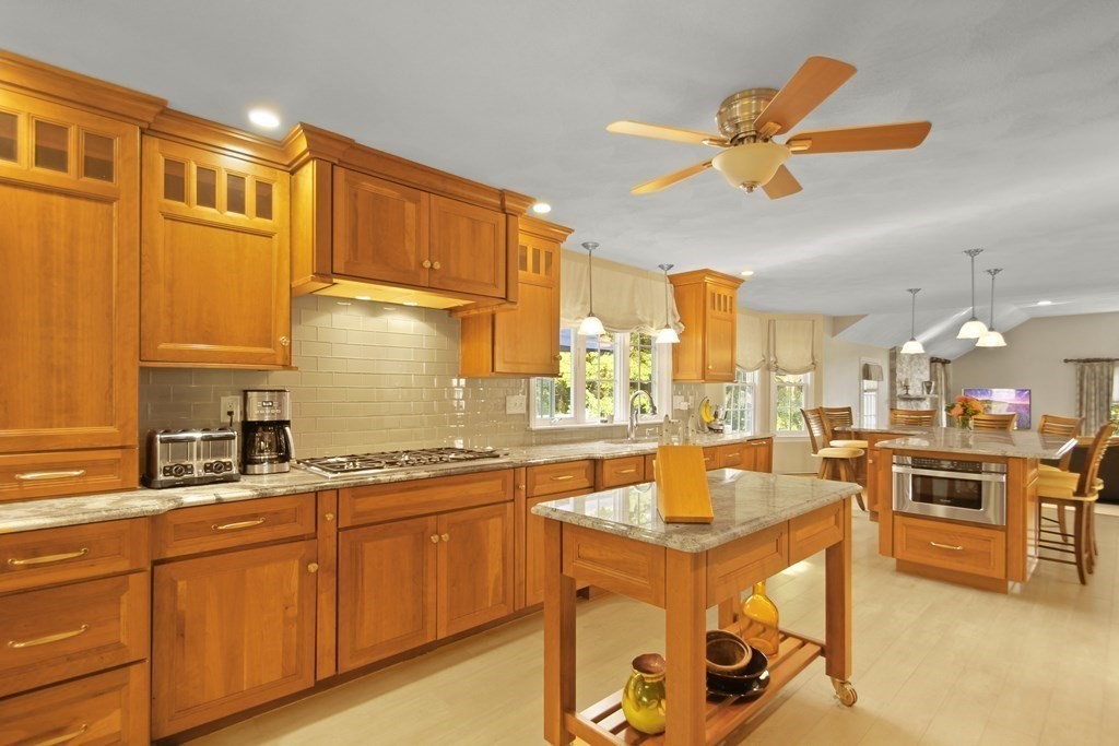 5 Judith E Lane Methuen, MA 01844 - Photo 5 of 38 a kitchen with stainless steel appliances granite countertop a sink stove and refrigerator
