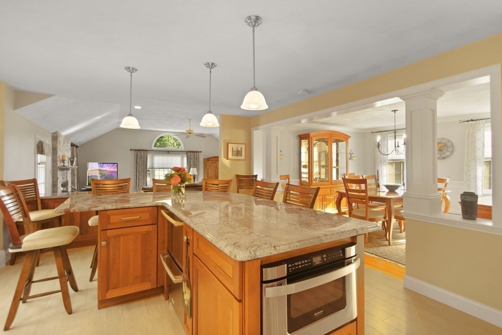 5 Judith E Lane Methuen, MA 01844 - Photo 9 of 38 a kitchen with a stove center island and couches