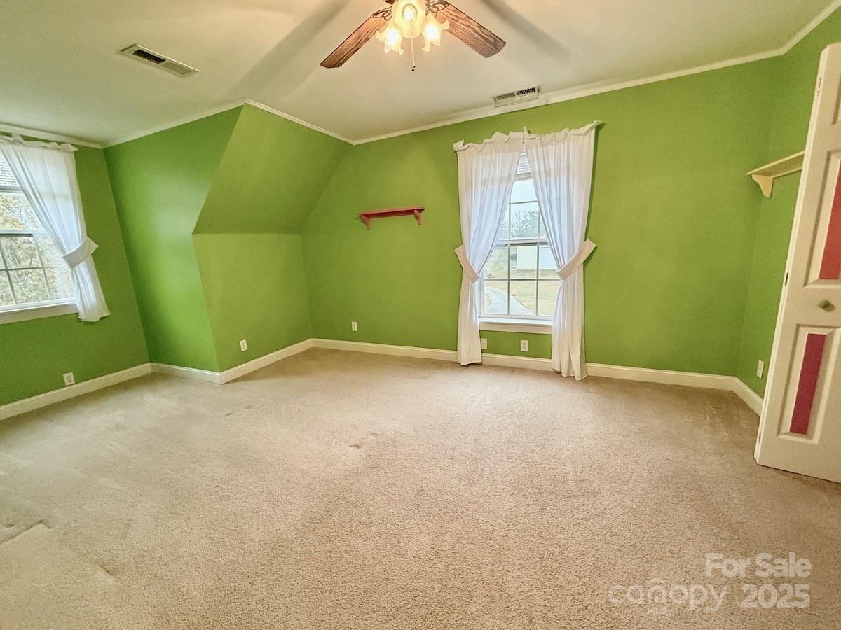 1054 Sandy Springs Road Rutherfordton, NC 28139 - Photo 19 of 33 a view of an empty room with window and stairs