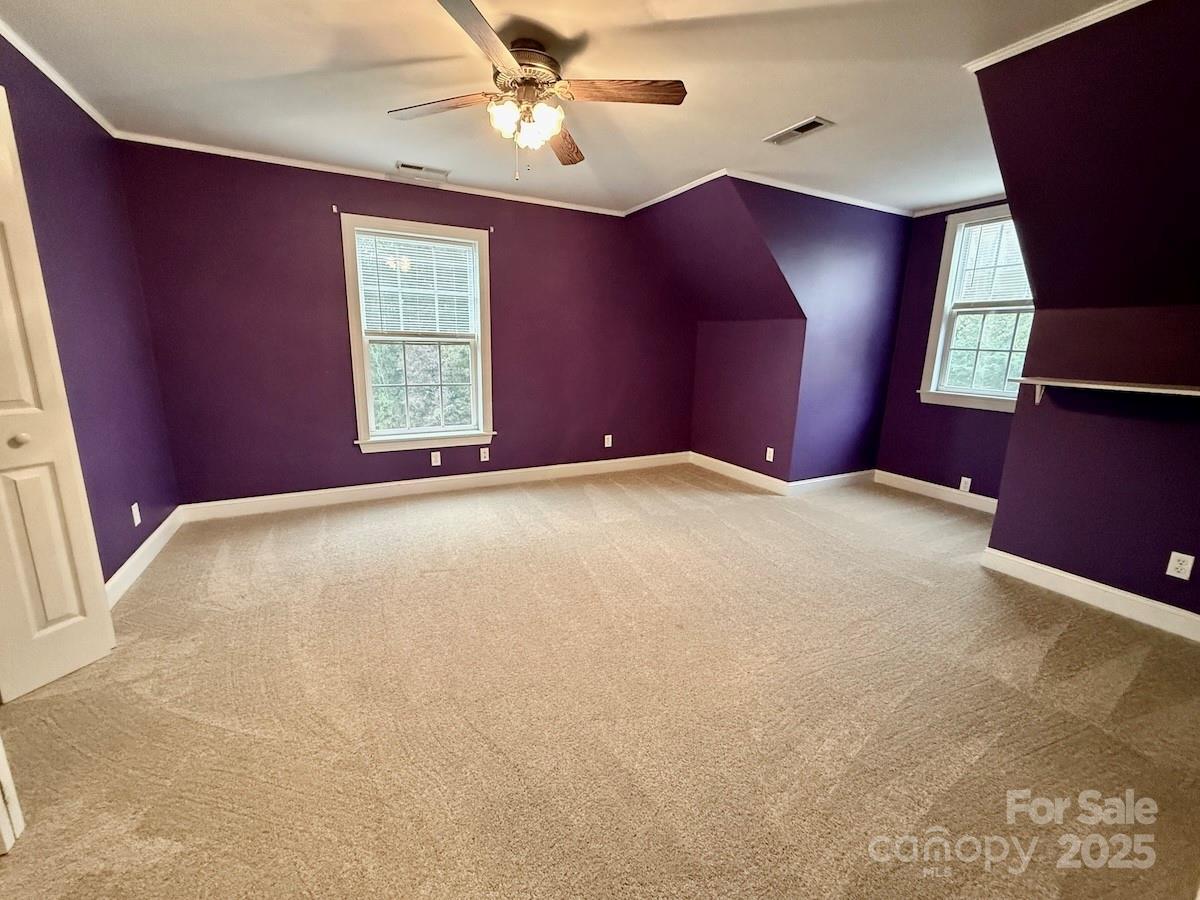 1054 Sandy Springs Road Rutherfordton, NC 28139 - Photo 22 of 33 a view of a livingroom with a window and a ceiling fan