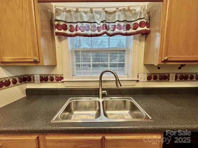 a kitchen with a sink and a stove