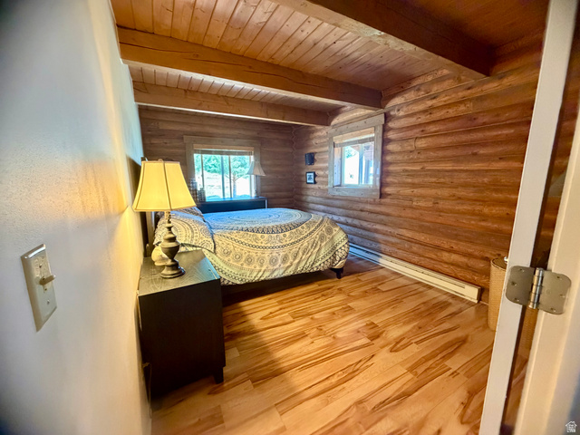 358 Maple Drive Fish Haven, ID 83287 - Photo 10 of 21 Interior space featuring wood-finish flooring and log walls