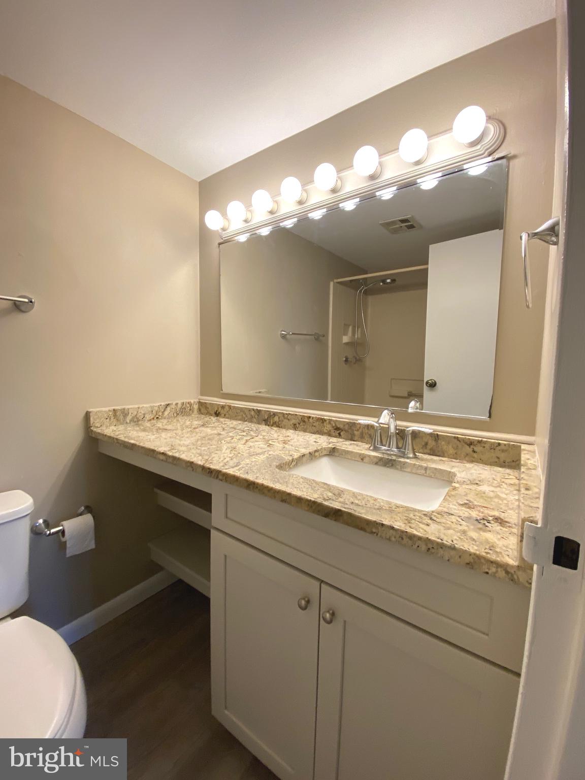 4000 Gypsy Lane, Unit 520 Philadelphia, PA 19129 - Photo 13 of 18 a bathroom with a sink and a mirror