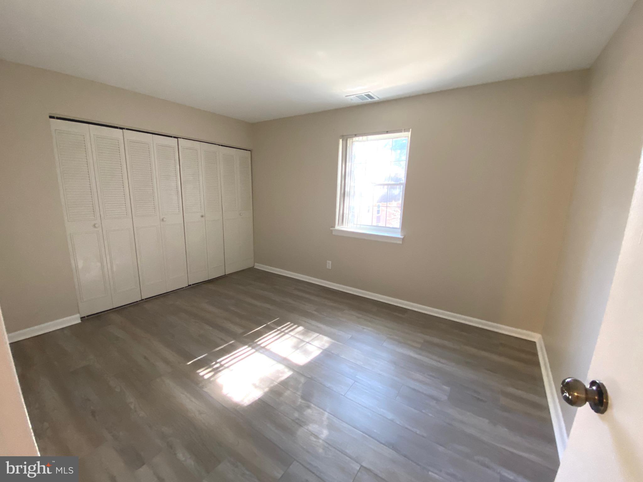 4000 Gypsy Lane, Unit 520 Philadelphia, PA 19129 - Photo 15 of 18 a view of empty room with wooden floor and fan