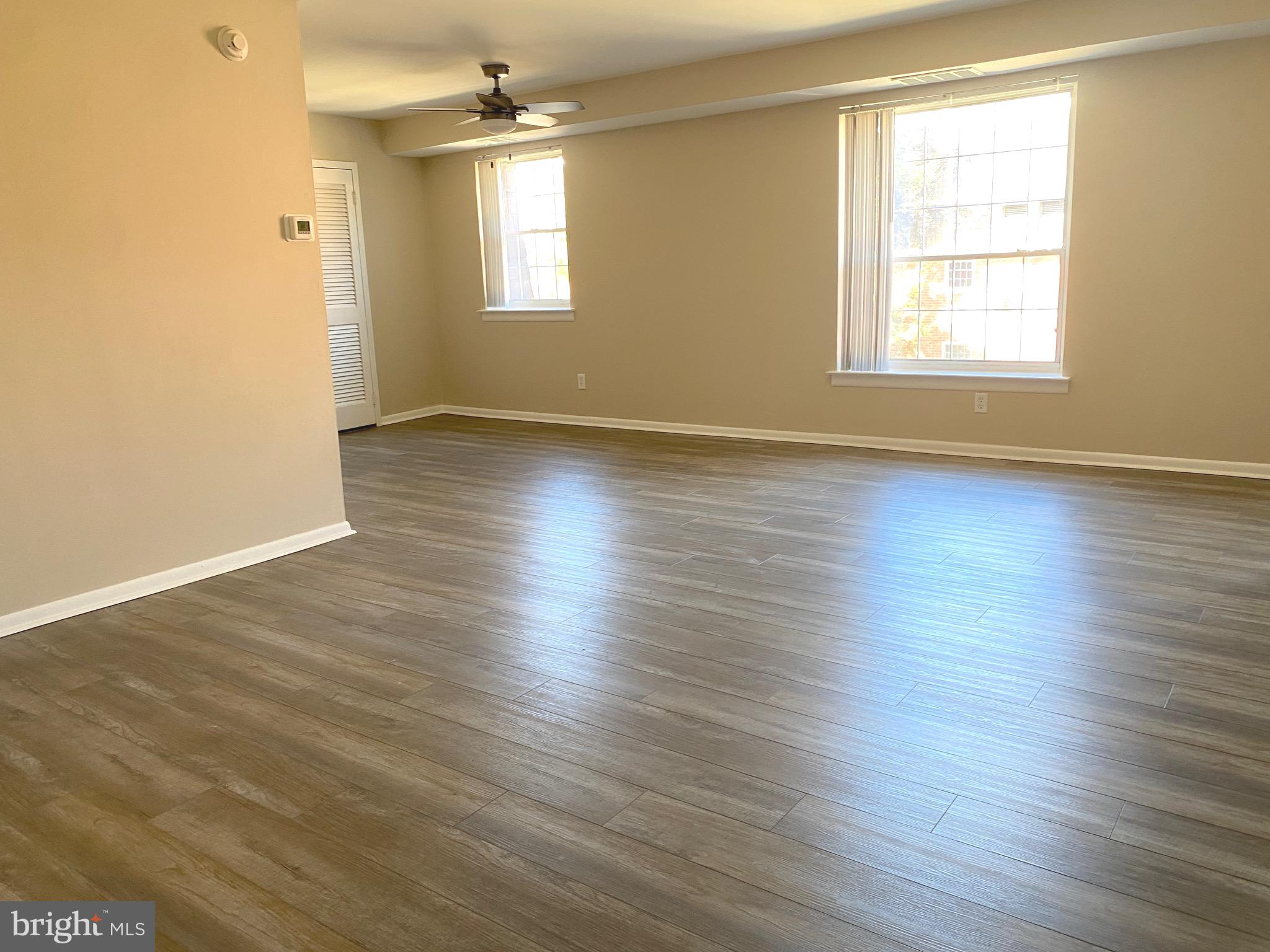 4000 Gypsy Lane, Unit 520 Philadelphia, PA 19129 - Photo 7 of 18 an empty room with wooden floor and windows