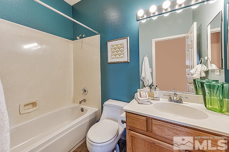 10442 Rockport Lane Reno, NV 89521 - Photo 17 of 17 a bathroom with a sink a toilet and shower